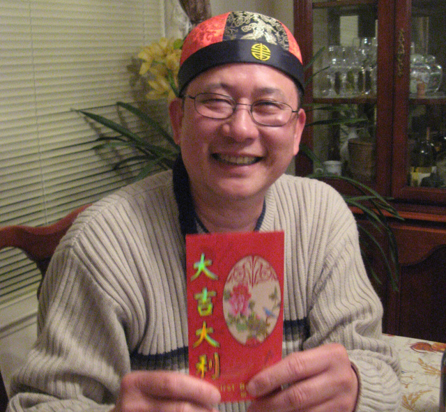 He is always willing to do the silliest of things when it comes to a good photo opp. “Gung hay fat choy! Now put this money into your future kids’ college funds.”